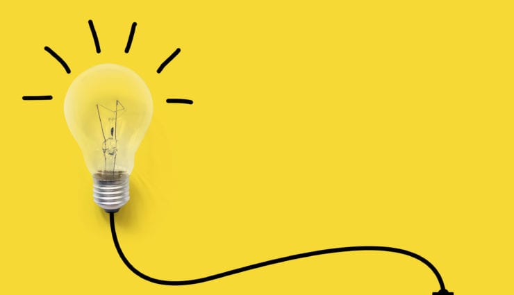 Light bulb on yellow background