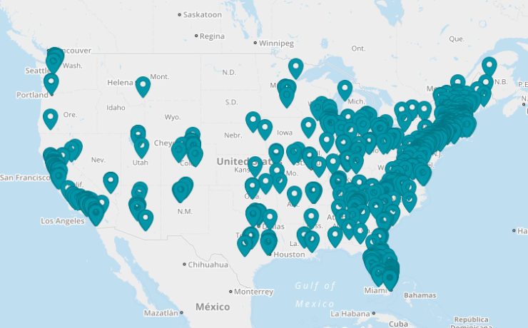 U.S. map with teal pins indicating locations of schools