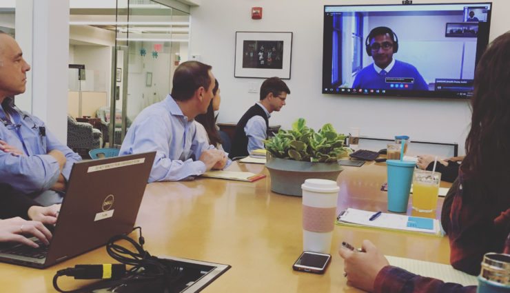 CS&A staff sitting around conference table