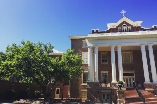 St. Mary's school building with red bricks and white columns