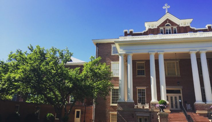 St. Mary's school building with red bricks and white columns