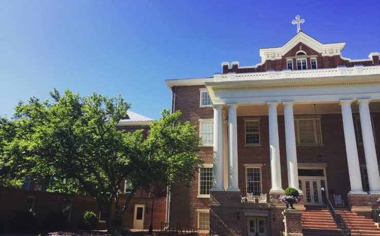 St. Mary's school building with red bricks and white columns