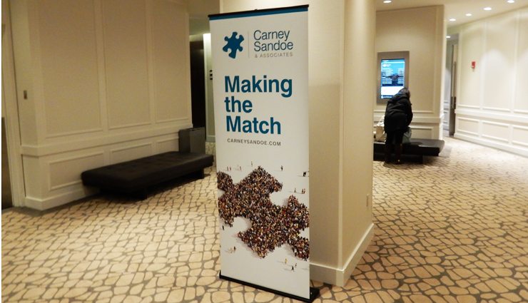 Carney Sandoe Making the match banner hanging in conference hallway