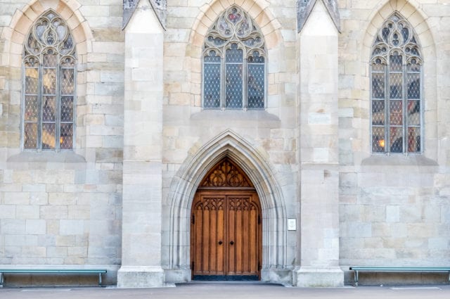 Giant door and window arches with wall of church