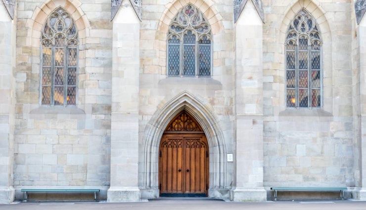 Giant door and window arches with wall of church