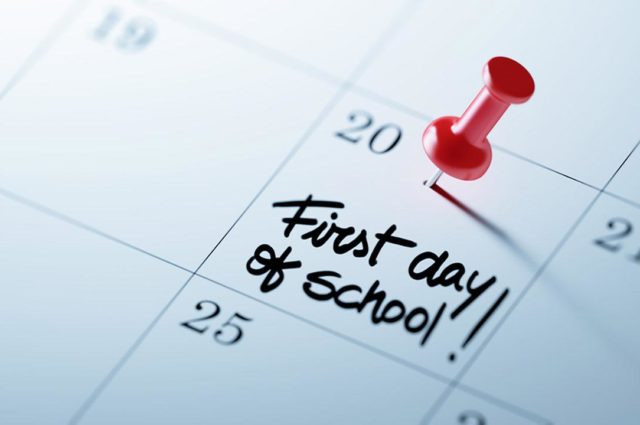 Calendar with first day of school marked with push pin