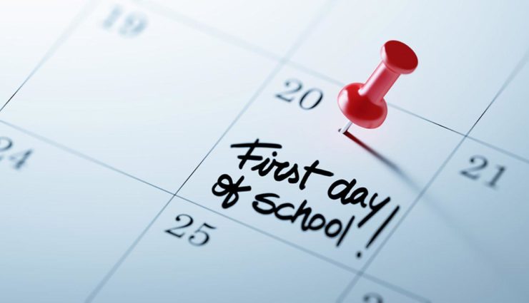 Calendar with first day of school marked with push pin