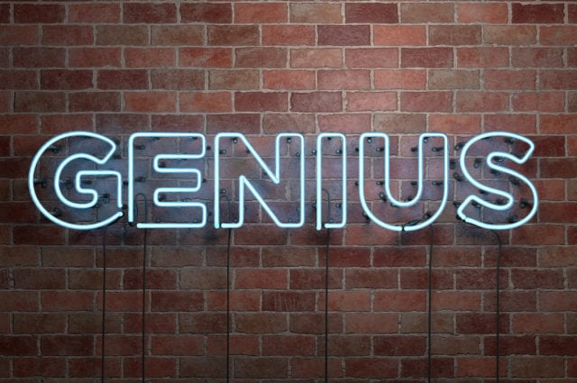 GENIUS - fluorescent Neon tube Sign on brickwork