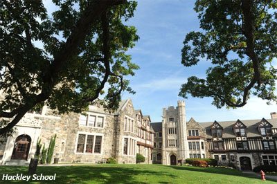 gothic style campus buildings with trees and grass at Hackley school