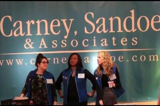 three csa employees with the logo behind