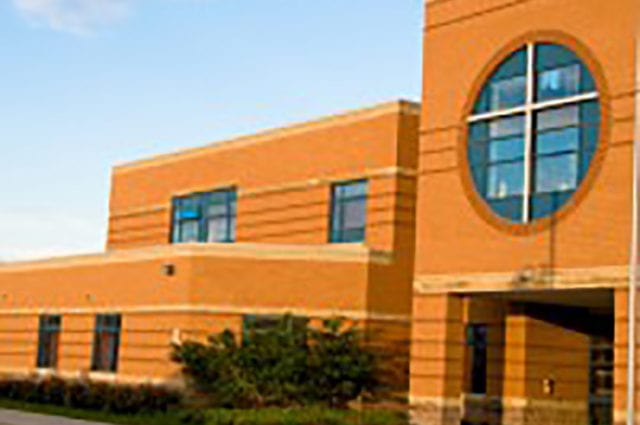 Entrance to yellow brick school building