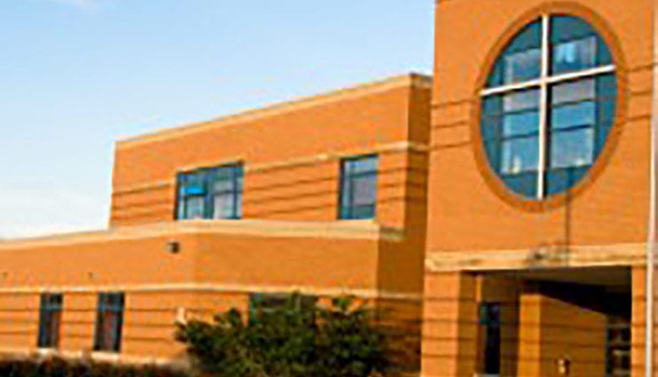 Entrance to yellow brick school building