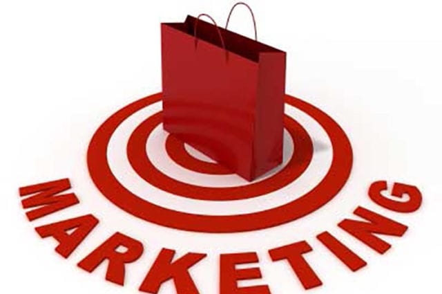 Red target with red bag on top and marketing written below