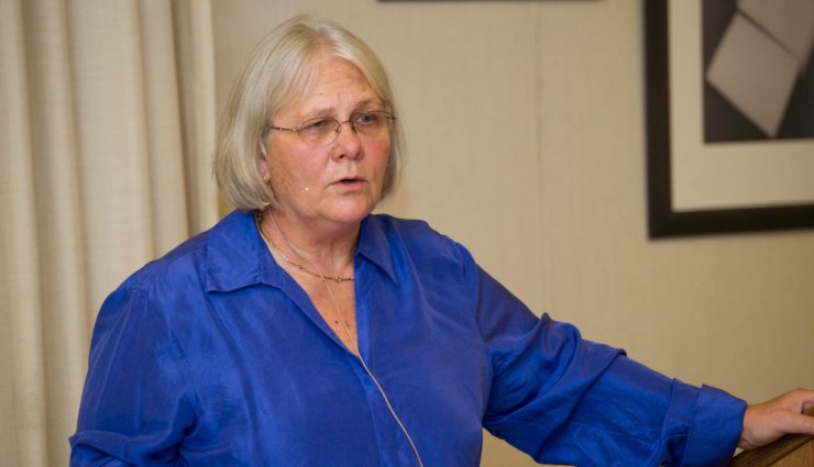 JoAnn Deak speaks with a microphone headset