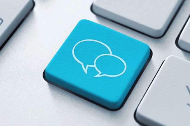 close up of computer keyboard blue with conversation bubbles