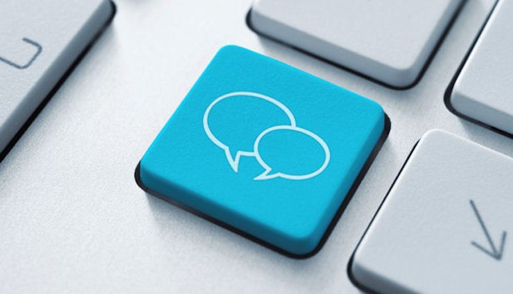 close up of computer keyboard blue with conversation bubbles