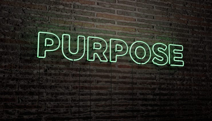 The word purpose as a green neon sign