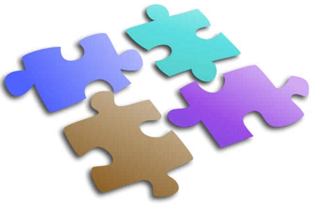 four varying colored puzzle pieces