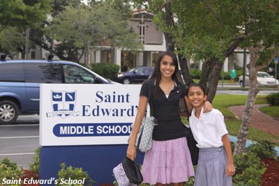 two students pose outside St. Edward's middle school entrance
