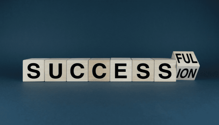 blocks with a single letter on each, spelling out the word success, then a final block, one side says full and one says ion