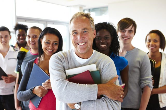 A group of diverse teachers smiling