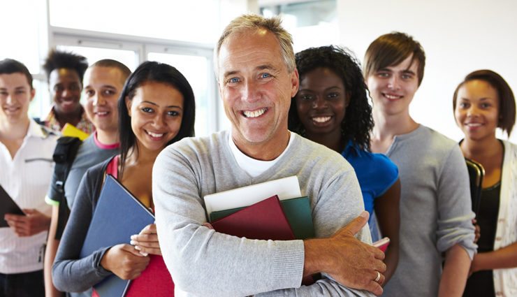 A group of diverse teachers smiling