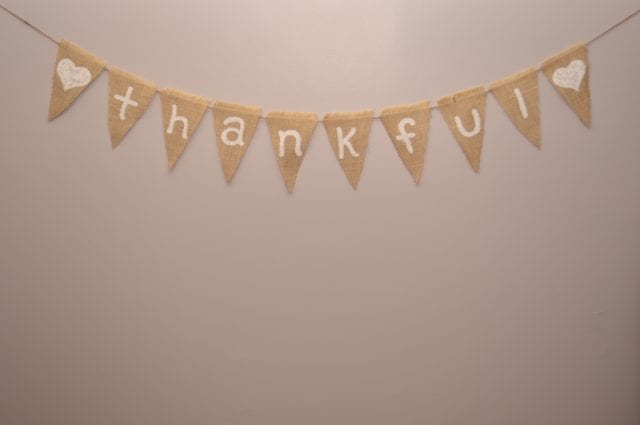 Thankful burlap sign on light beige background