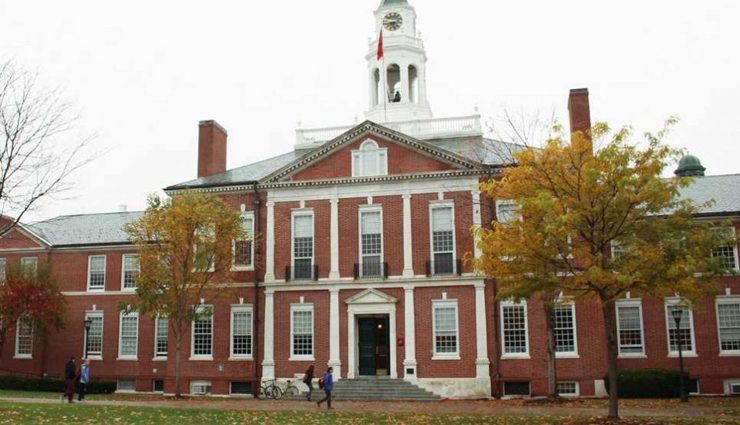 Red brick colonial style boarding school building with bell atop
