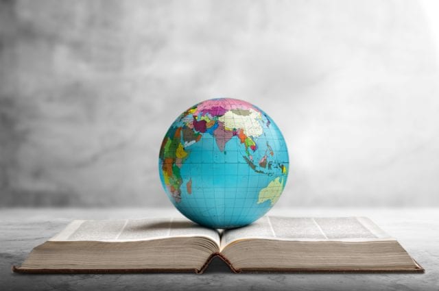 Globe on top of an open book