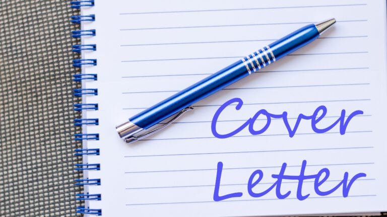 Notepad and pen on wooden background and text concept
