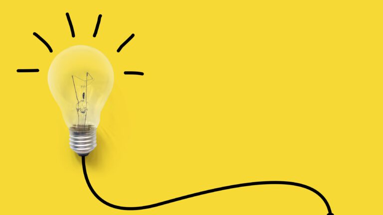Light bulb on yellow background