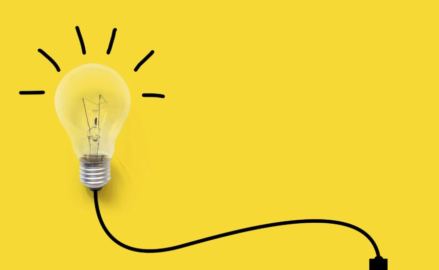 Light bulb on yellow background