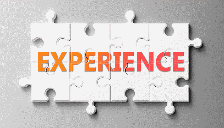 Puzzle pieces forming the word "Experience" in a gradient of orange to pink on a light textured background.