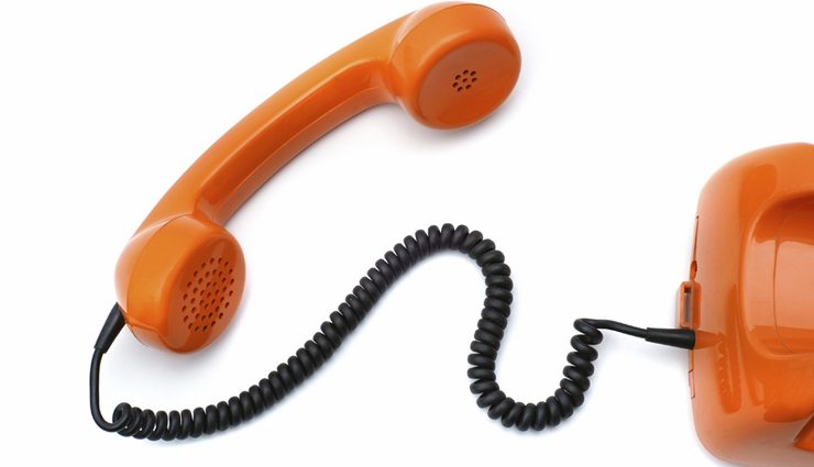 orange phone with spiral black phone