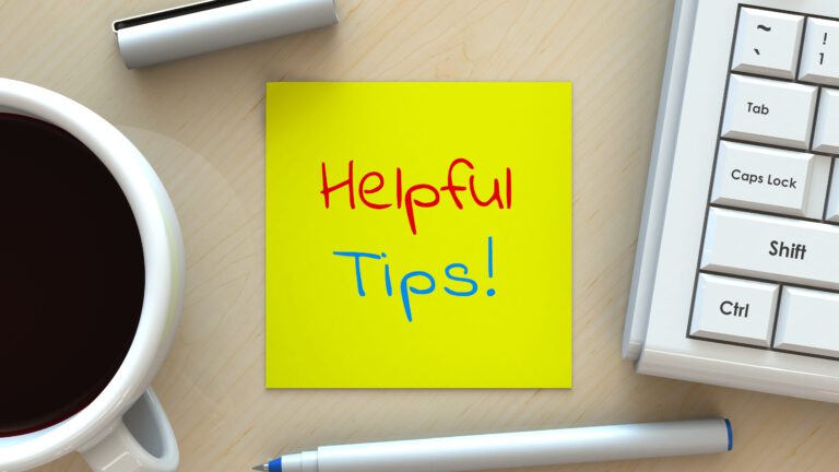 Helpful Tips, message on note paper, computer and coffee on table