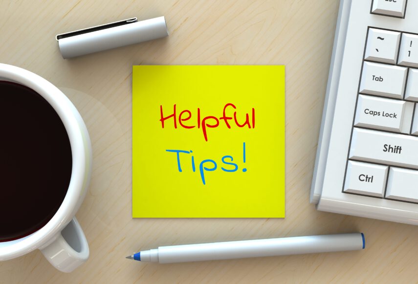 Helpful Tips, message on note paper, computer and coffee on table