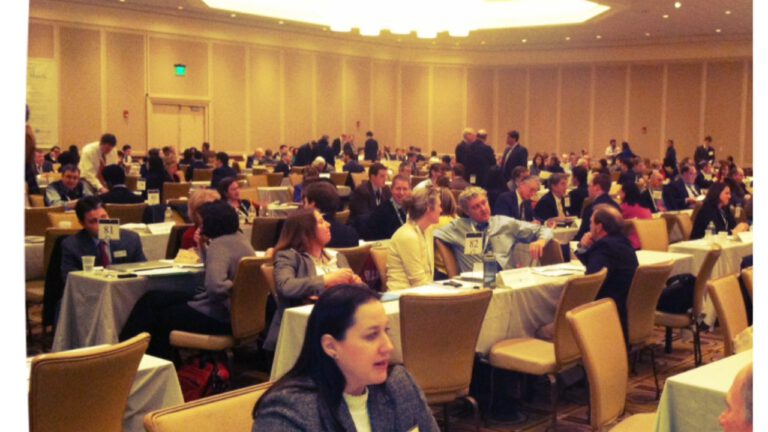tables in a ballroom of conference interviews