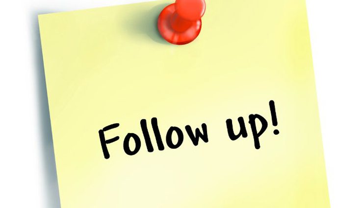 yellow post it note reads "follow up!" with red push pin