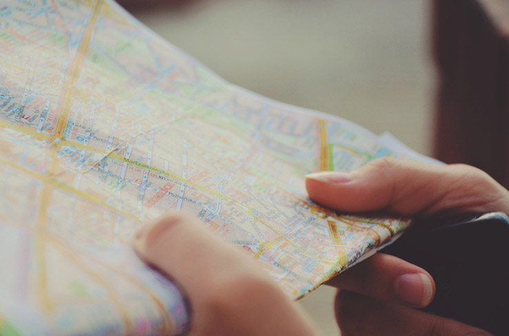 hands hold a map