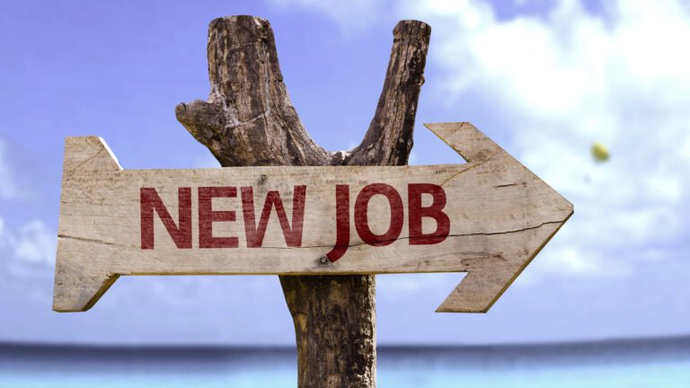 New job sign against background of clear sunny ocean