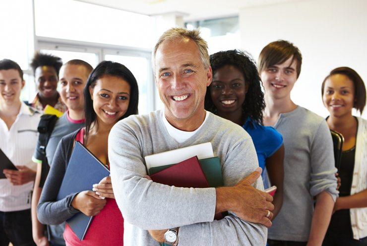 A group of diverse teachers smiling