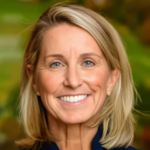 Smiling person with blond hair and green background.